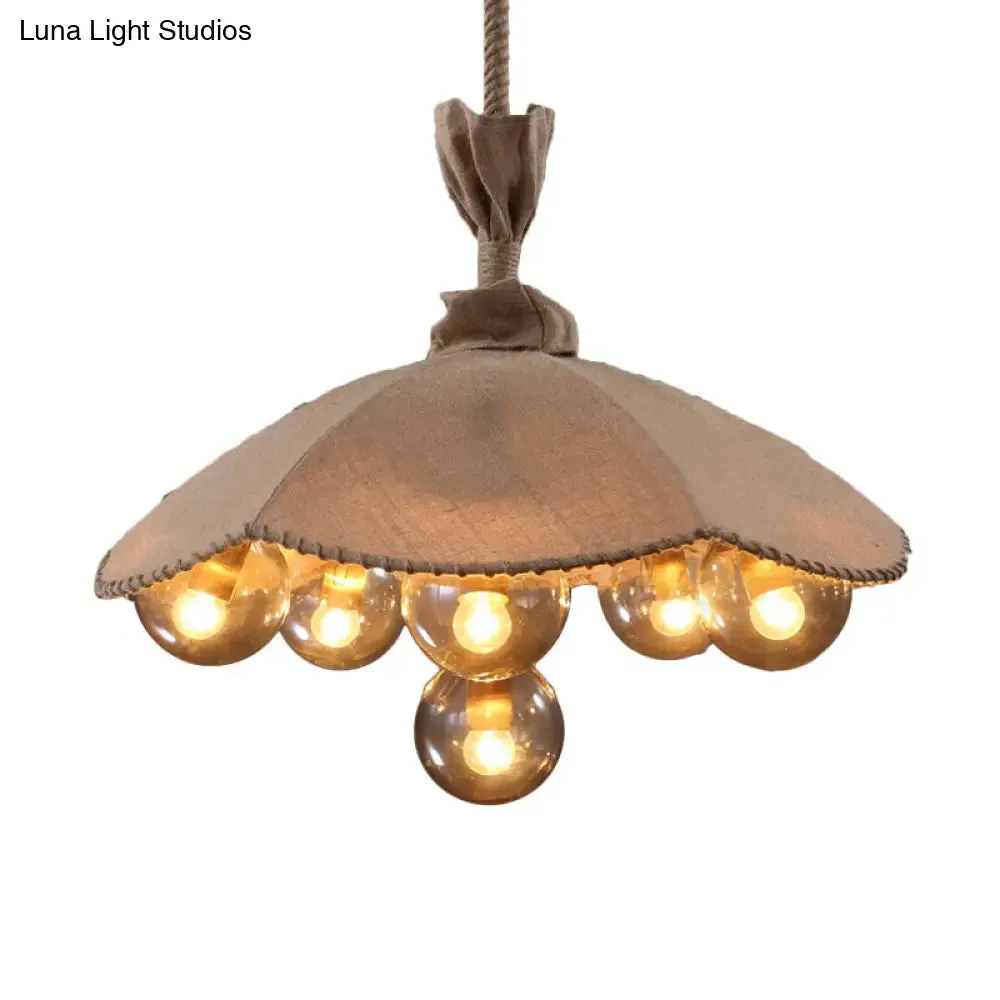 Beige Scalloped Pendant Light: Lodge Chandelier with 6 Fabric Heads & Glass Ball Shade