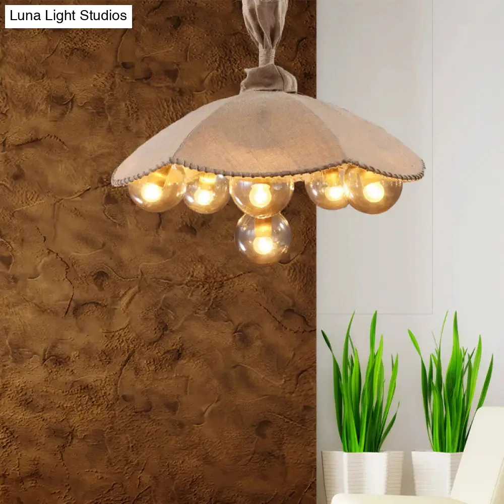 Beige Scalloped Pendant Light: Lodge Chandelier with 6 Fabric Heads & Glass Ball Shade